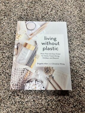 Living Without Plastic Book featuring illustrated steps to reduce plastic use